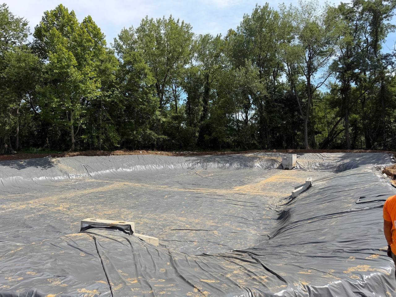 PVC liner installation in stormwater basin
